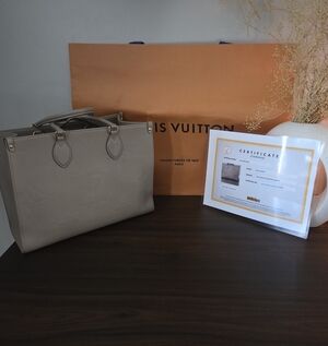 Louis Vuitton OnTheGo MM Monogram Empreinte Leather Tote Bag